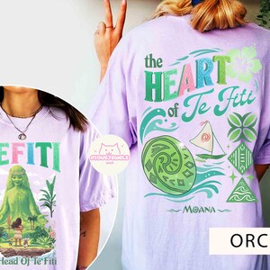 May include: Orchid-colored t-shirts with graphics from the animated film Moana. One shirt features the text "TEFITI" and an image of the character Te Fiti. The other shirt displays "the HEART of Te Fiti" with Moana-themed illustrations.