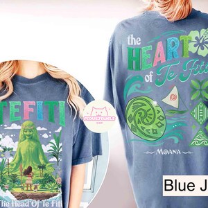 May include: Blue jean colored t-shirts with graphics from the movie Moana. One shirt features the text "TEFITI" with a green goddess figure. The other shirt has "the HEART of Te Fiti" with Moana's name.