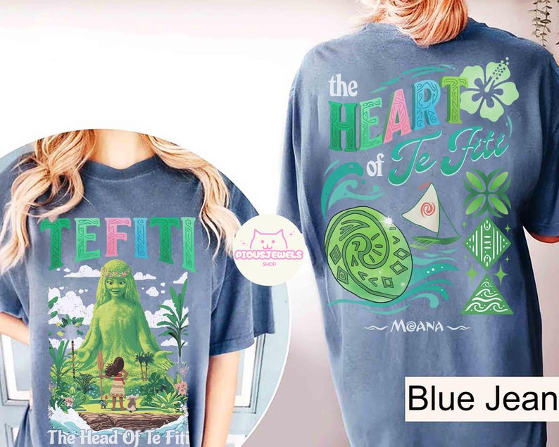 May include: Blue jean colored t-shirts with graphics from the movie Moana. One shirt features the text "TEFITI" with a green goddess figure. The other shirt has "the HEART of Te Fiti" with Moana's name.