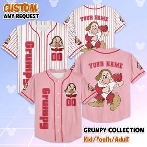 May include: Baseball jerseys in white and pink with Grumpy from Snow White. The jerseys have the word "Grumpy" and the number "00" on the front. The text "YOUR NAME" is on the back. The text "CUSTOM ANY REQUEST" is at the top.