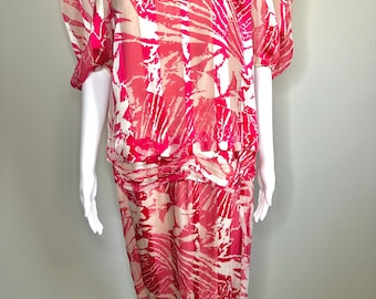 May include: A pink and white patterned dress with a gathered skirt and puffed sleeves.