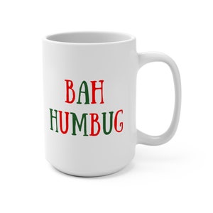 May include: White ceramic coffee mug with the text "BAH HUMBUG" in red and green letters.