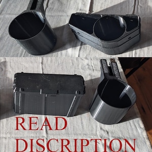 May include: Black 3D-printed objects, including a cylindrical cup with a handle, a rectangular box, and a multi-compartment piece. The text "READ DISCRIPTION" is printed in red at the bottom of the image. The objects are on a textured, light-colored surface.