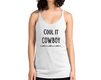 May include: A white tank top with the text "COOL IT COWBOY" in black lettering. A barbed wire design is below the text.