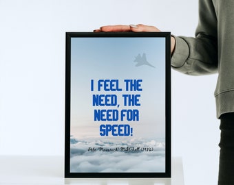 May include: A black framed print with a blue sky and clouds background. The text "I FEEL THE NEED, THE NEED FOR SPEED!" is in blue text with the words "Pete 'Maverick' Mitchell (1986)" in smaller blue text below.