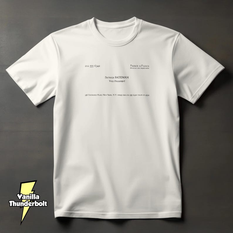 May include: A white short-sleeved t-shirt featuring a black printed business card design on the chest. The text reads Pierce & Pierce, Patrick Bateman, Vice President, along with a New York address and phone number, mimicking a professional card.
