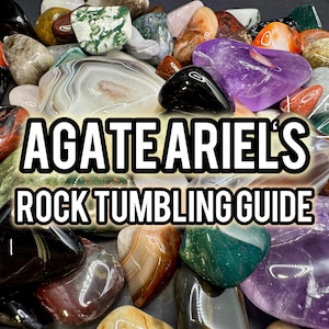 May include: A collection of polished gemstones in various colors, including red, black, purple, and green. The image features the text "AGATE ARIEL'S ROCK TUMBLING GUIDE" in a bold, white font, suggesting a guide for rock tumbling.