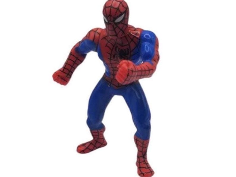 May include: A red, blue, and black Spider-Man action figure in a dynamic pose. The figure has a red mask and suit with a web pattern, blue accents, and a black spider emblem on the chest. The figure is standing with one arm raised.