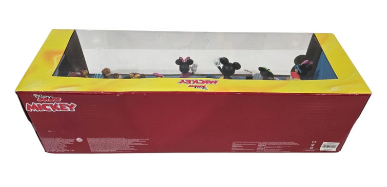 May include: A rectangular box with a clear plastic window, featuring Disney's Mickey Mouse characters. The box is red with yellow trim and the words "Disney Junior Mickey" are visible. Several Mickey Mouse figurines are inside.