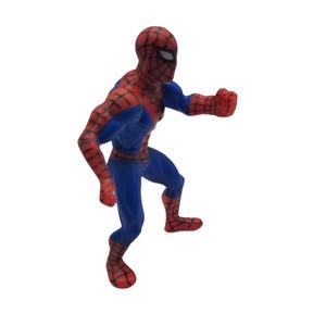 May include: A red and blue Spider-Man action figure in a dynamic pose. The figure is wearing a classic Spider-Man suit with a red mask and web pattern. The figure is in a running or jumping position.