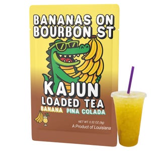 May include: A package of "Bananas on Bourbon St" Kajun Loaded Tea, Banana Pina Colada flavor, with a cartoon alligator wearing sunglasses. A yellow drink with a purple straw sits next to the package. The package is 0.32 oz (9g).
