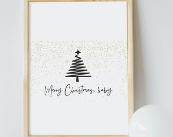 Peut inclure: Une impression encadrée avec une silhouette noire d'un sapin de Noël avec des paillettes dorées sur un fond blanc. Le texte "Merry Christmas, baby" est écrit sous l'arbre.