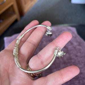 Beautiful silver bangle with elephant dangling at the back rare piece very pretty gift for her