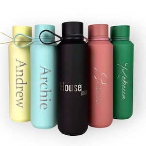 May include: Five colorful insulated water bottles. The bottles are yellow, teal, black, pink, and green. Each bottle has a name engraved on it in silver. The black bottle has the text "House eco".