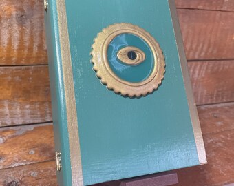 Handmade & painted green w/ gold decoration wooden book storage /trinket box. Featuring eye decoration.