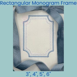 May include: A rectangular monogram frame with a blue embroidered border and a white center. The frame is surrounded by a blue ribbon. Text at the top reads "Rectangular Monogram Frame". The bottom text indicates sizes: 3", 4", 5", 6".