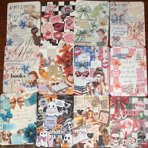 May include: A collection of decorative rectangular cards with various designs. Some cards feature floral and bow motifs, while others have text like "Hello May" and "Spooky Reader." The color palette includes pastels, reds, and blacks.