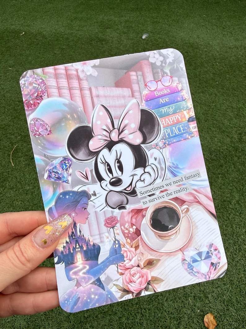 May include: A decorative card featuring Minnie Mouse with a pink bow, surrounded by a collage of books, diamonds, and a princess. The card includes the text "Books Are my HAPPY PLACE" and "Sometimes we need fantasy to survive the reality."