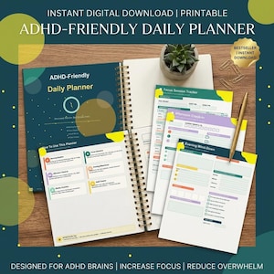 Peut inclure: Un agenda quotidien à spirales ouvert avec le texte "ADHD-Friendly Daily Planner" sur la couverture. Plusieurs pages sont visibles, dont un "Focus Session Tracker" et une section "Evening Wind-Down". Un stylo doré et des trombones sont également présents.