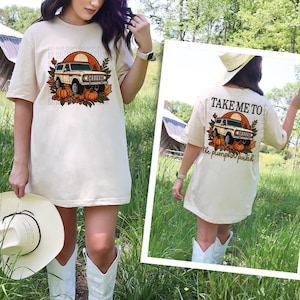May include: A beige t-shirt with a vintage-style illustration of a car and pumpkins. The text "Take me to the pumpkin patch" is printed on the back of the shirt.