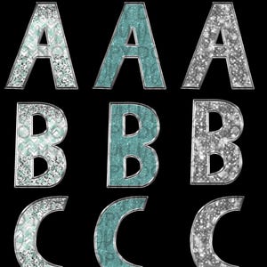 May include: A set of three letters, A, B, and C, in a glittery silver and teal color scheme. The letters are outlined in silver and have a sparkly, winter wonderland theme.