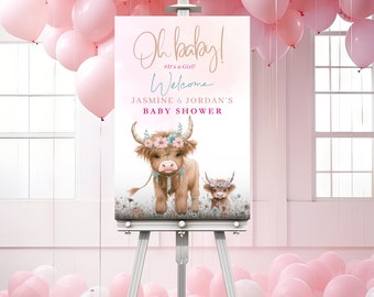 May include: A pink and white welcome sign for a baby shower with a cartoon illustration of two Highland cows wearing floral crowns. The sign reads "Oh baby! #It's a Girl! Welcome Jasmine & Jordan's Baby Shower".