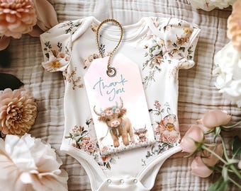 May include: A pink and blue thank you tag with a floral design and a cartoon Highland cow with a flower crown. The text on the tag says "Thank you".