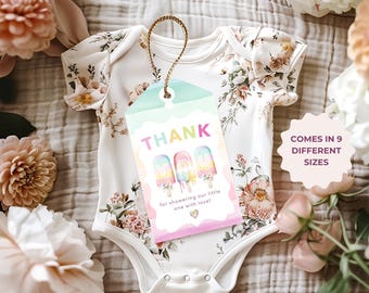 May include: A white baby onesie with a floral pattern and a tag that says "THANK YOU" with popsicle graphics. The tag reads "for showering our little one with love!" and "COMES IN 9 DIFFERENT SIZES".