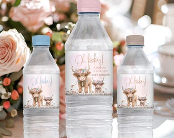 May include: Three water bottles with personalized labels for a baby shower. The labels feature a cartoon Highland cow with flowers and the text "Oh baby!"  "Jasmine & Jordan" and "Baby Shower".