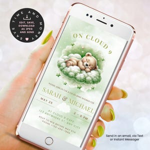 May include: A smartphone screen shows a baby shower invitation featuring a sleeping teddy bear on a cloud. The invitation says "On Cloud 9" and provides details for Sarah & Michael's co-ed baby shower. The phone is held by a person.