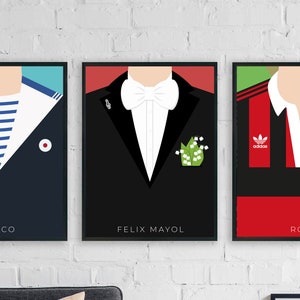 May include: Three framed illustrations of different clothing styles. The first is a navy blue sailor shirt with a white collar and a white and blue striped undershirt. The second is a black tuxedo with a white bow tie and a green lily of the valley boutonniere. The third is a black and red rugby jersey with white accents and the Adidas logo.