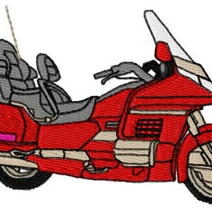 May include: A red and cream colored motorcycle with a windshield and saddlebags. The motorcycle has a chrome exhaust pipe and a black seat.