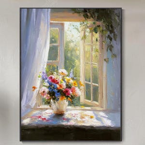 May include: A framed oil painting depicts a sunlit window with an open view. A vase of colorful flowers sits on the windowsill. The painting's style is impressionistic, with soft brushstrokes and a focus on light and color. The artwork is displayed above a white sofa.