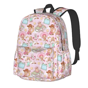 May include: A light pink backpack featuring a repeating pattern of Toy Story characters including Woody, Buzz Lightyear, Jessie, Forky, and Ducky, interspersed with small yellow stars and light blue rectangular frames containing the text Hi.