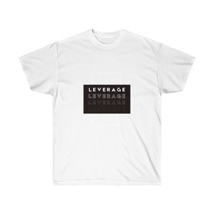 May include: White t-shirt with a black rectangle featuring the word "LEVERAGE" repeated four times in a gradient effect.