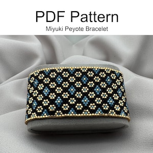 May include: A black, gold and blue beaded bracelet with a geometric pattern. The bracelet is on a grey velvet display stand. The text "PDF Pattern Miyuki Peyote Bracelet" is above the bracelet.