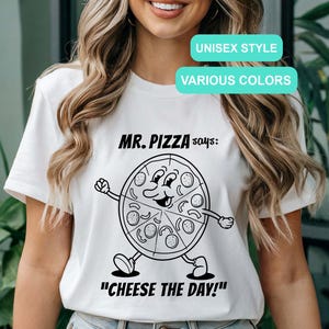 May include: White t-shirt with a black and white illustration of a pizza character saying "MR. PIZZA says: "CHEESE THE DAY!" "