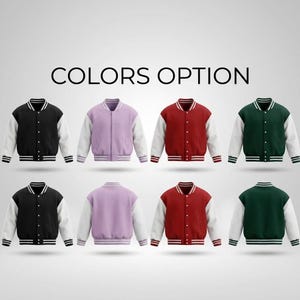 May include: A display of letterman jackets in various colors, including black, lavender, red, and green, with white sleeves. Each jacket has a striped collar, cuffs, and hem. The text "COLORS OPTION" is displayed above the jackets.