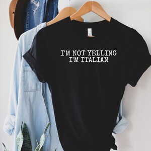 May include: Black t-shirt with white text that reads "I'm not yelling I'm Italian".