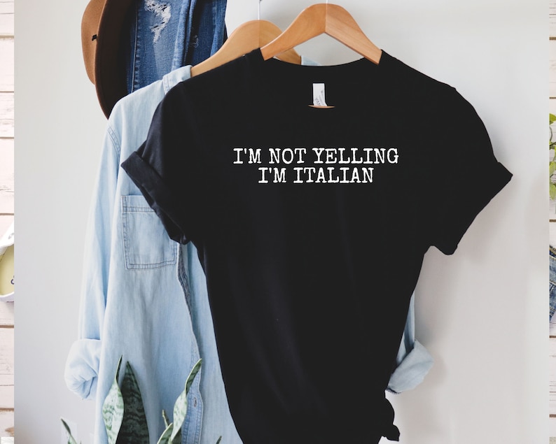 May include: Black t-shirt with white text that reads "I'm not yelling I'm Italian".