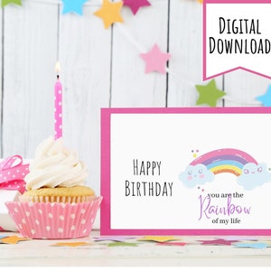 May include: Pink birthday card with a rainbow and clouds. The card says "Happy Birthday, you are the rainbow of my life."