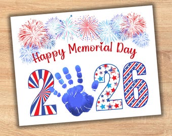May include: A patriotic Memorial Day greeting card with fireworks and the text "Happy Memorial Day 2026." The numbers are decorated with red, white, and blue patterns, and a blue handprint is in the center.