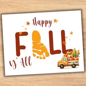 May include: A white rectangular sign featuring the brown text Happy Fall y'all. The letter A in Fall is replaced by an orange footprint. Small orange and yellow leaves surround the text. A small orange truck carries pumpkins and corn.