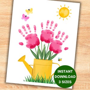 May include: A watercolor print featuring a bouquet of pink handprint flowers in a yellow watering can. Butterflies, a sun, and a bee are also depicted. The print includes the text "INSTANT DOWNLOAD 3 SIZES".