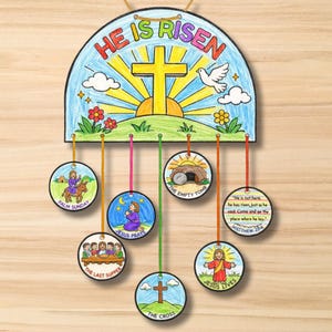 May include: A colorful Easter-themed wall hanging with the text "HE IS RISEN" above a cross, sun, and dove illustration. Below, circular illustrations depict scenes from the Easter story, including Palm Sunday and the empty tomb.