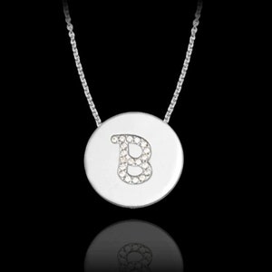 May include: A silver necklace with a round pendant featuring the letter "B" set with small diamonds.