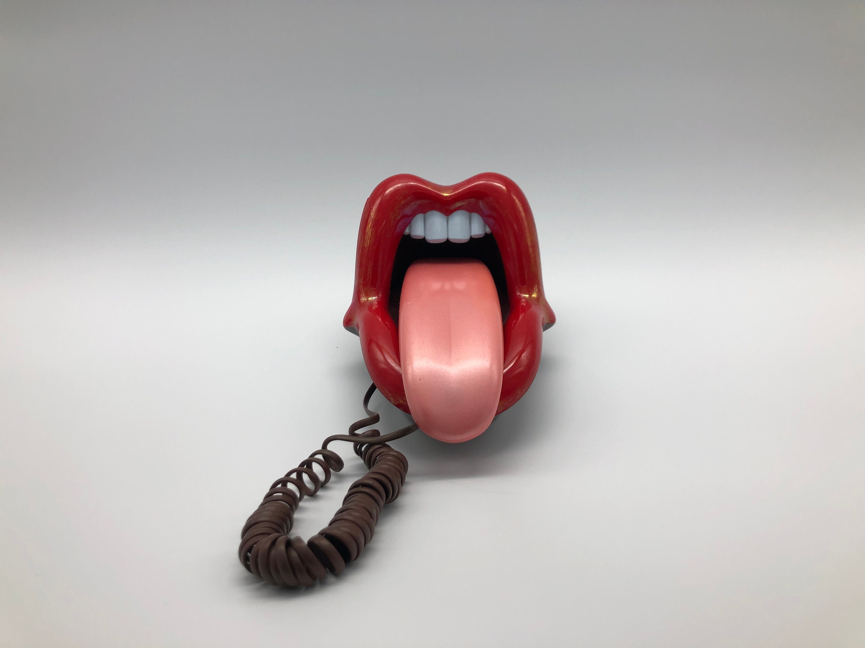 Retro-Style Landline Phone with Rock Band Theme and Pink Lips Design - Vintage and Functional