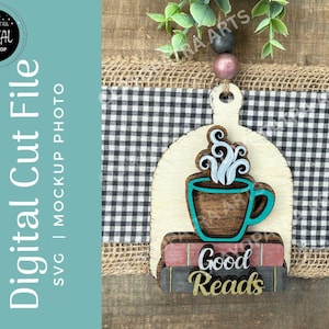 May include: Wooden cut file featuring a coffee cup with steam, set atop a stack of books with the words "Good Reads." The design is in shades of brown, teal, and white, with a rustic aesthetic. The background includes a black and white checkered pattern.