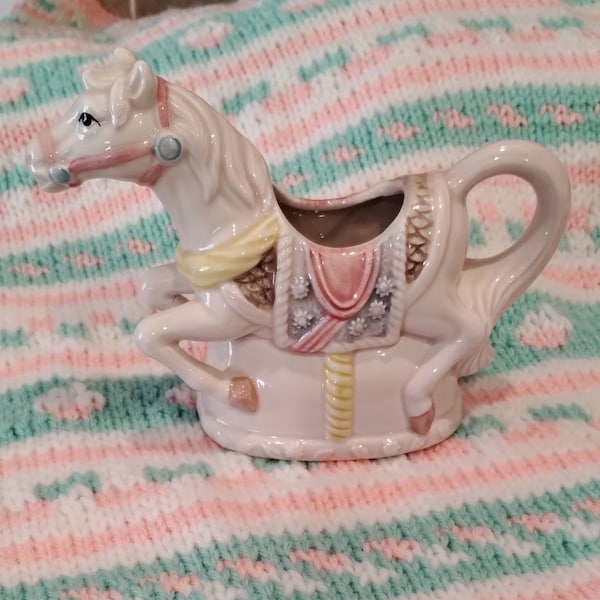 Vintage Ceramic Merry Go Round horse planter with  knitted Baby Blanket  Makes a Nice gift.