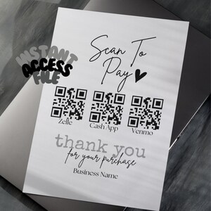 May include: A white card with black text that says "Scan To Pay" with a heart symbol. There are three QR codes labeled "Zelle", "Cash App", and "Venmo". The text "thank you for your purchase" and "Business Name" are also on the card.